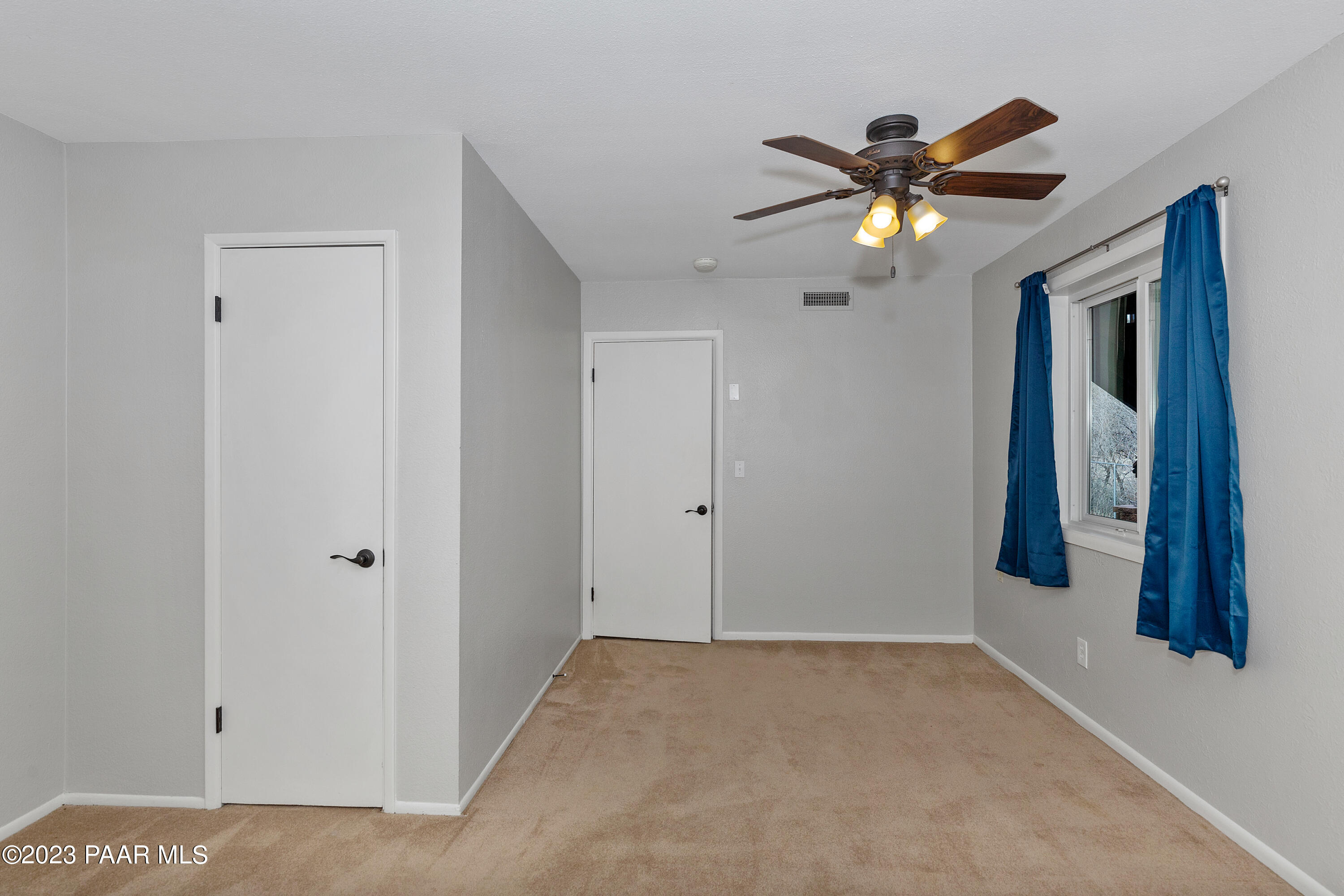450 Valley Place Prescott, AZ 86301 - Photo 31 of 44 a view of a hallway with a chandelier fan