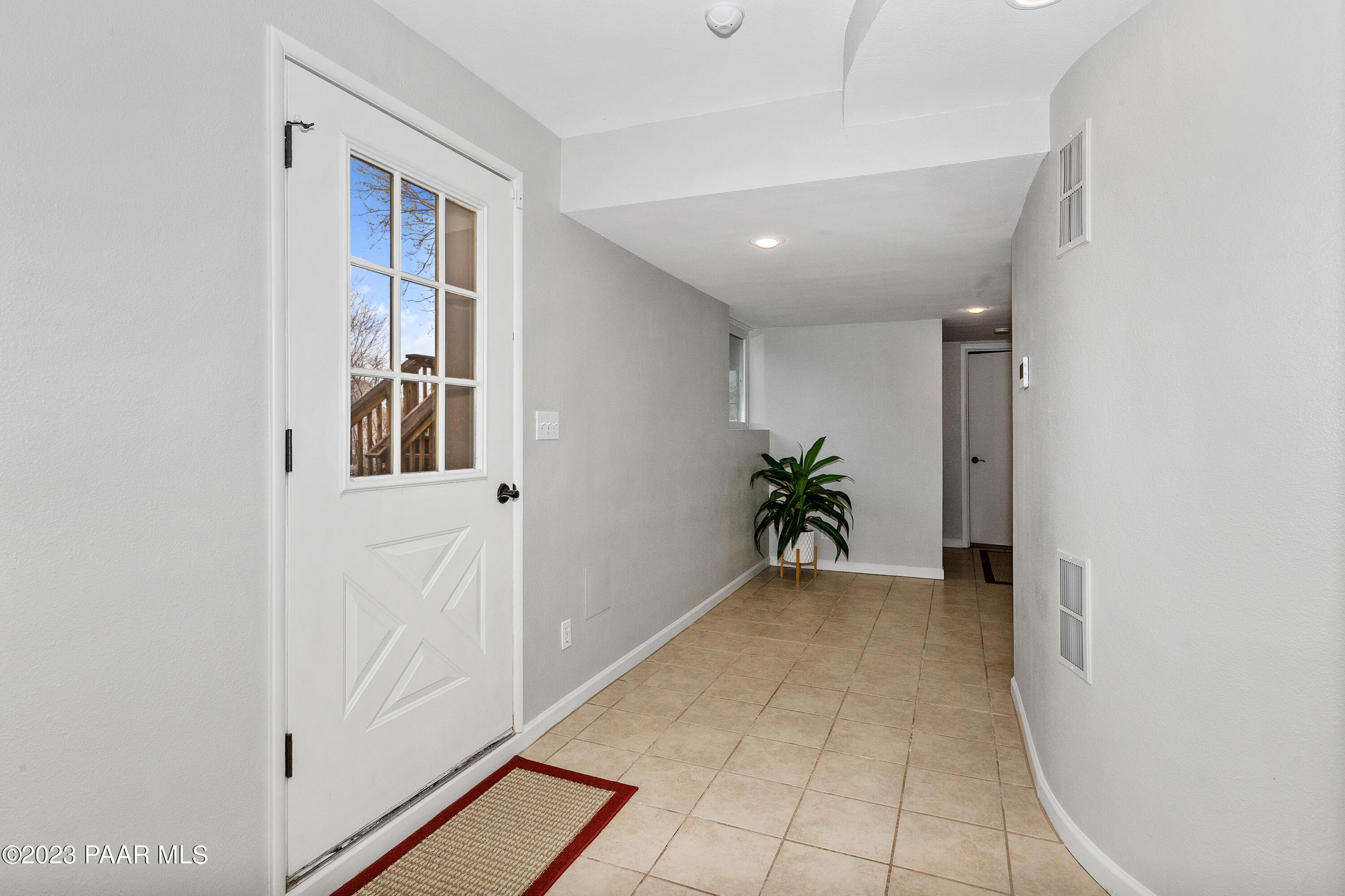 450 Valley Place Prescott, AZ 86301 - Photo 32 of 44 a view of a hallway with closet and a potted plant