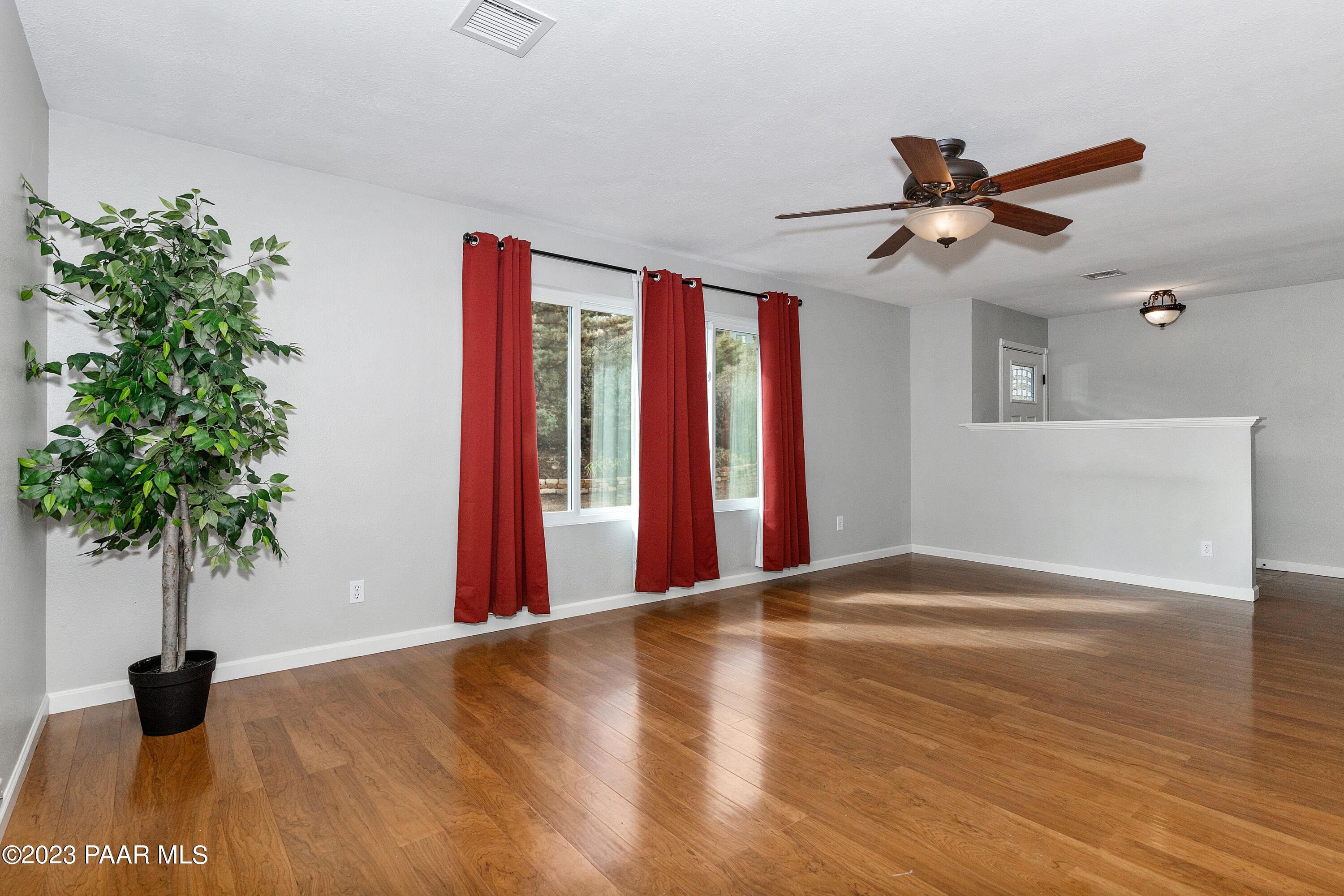 450 Valley Place Prescott, AZ 86301 - Photo 7 of 44 a view of an empty room with a window and a ceiling fan