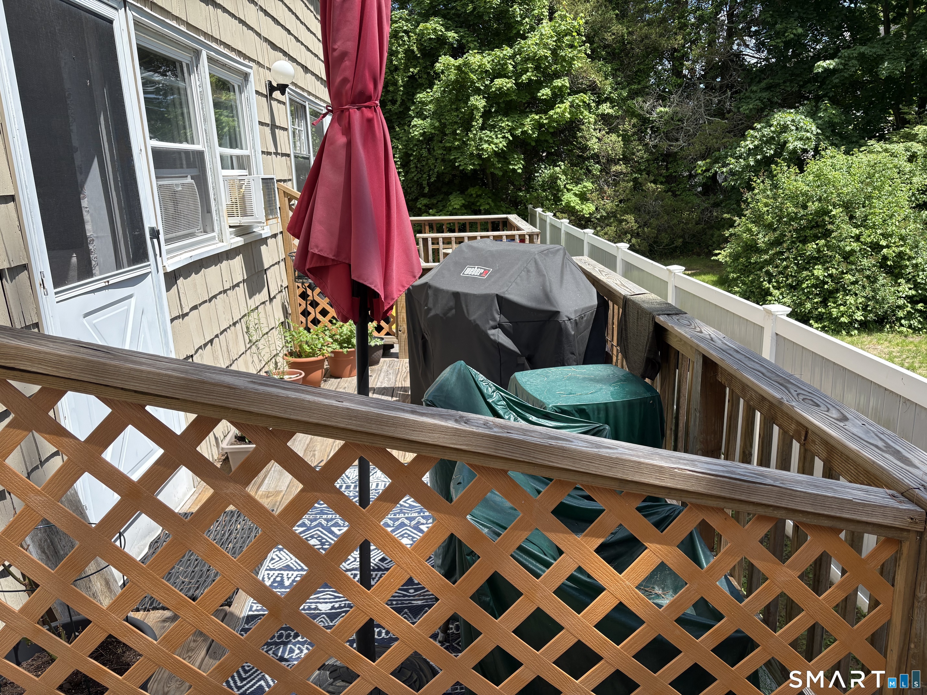 116 Commerce Street, Unit 5 Clinton, CT 06413 - Photo 16 of 18 a view of balcony with a small yard