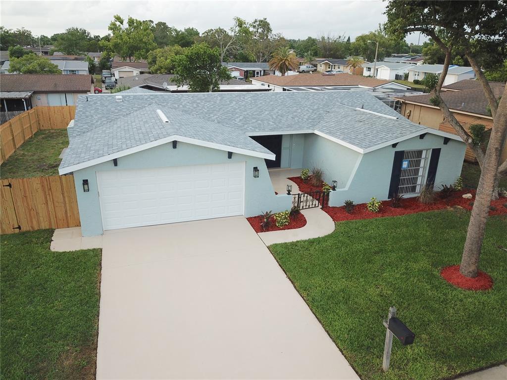 7831 Red Run Drive Port Richey, FL 34668 - Photo 1 of 1 a view of a house with a yard porch and sitting area