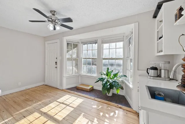 a bedroom with bed and a window