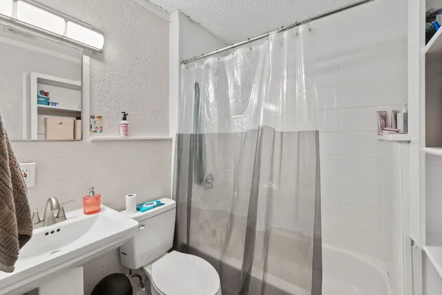 a bathroom with a shower and a tub