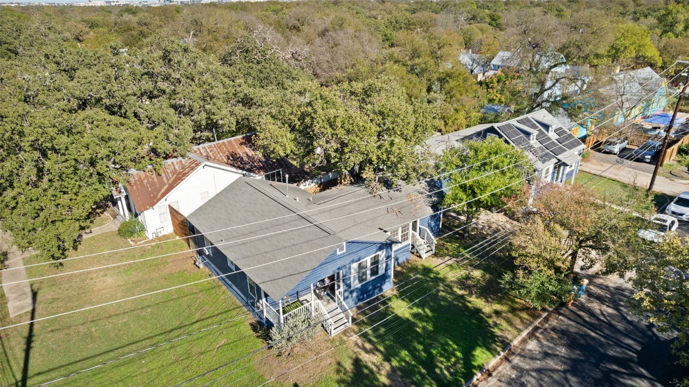1202 East 29th Street, Unit A Austin, TX 78722 - Photo 33 of 37 View from above of property with a heavily wooded area