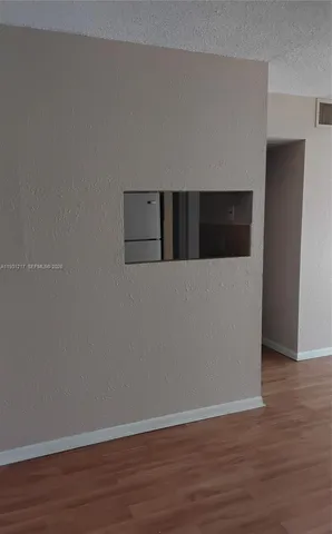a view of balcony with a floor to ceiling window wooden floor