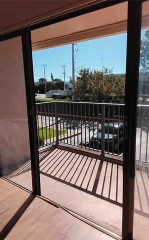 a view of a kitchen with wooden floor and entrance
