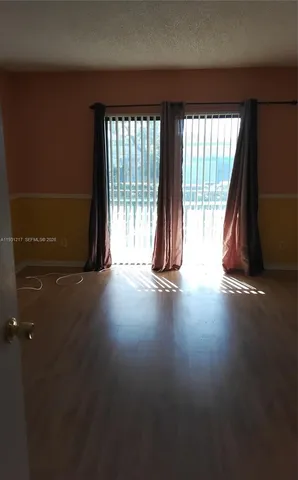 a white toilet sitting next to a bath tub