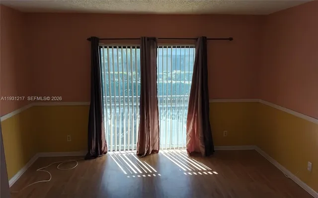 a white toilet sitting next to a bath tub