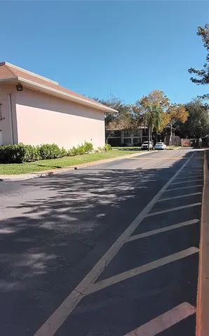 a view of a backyard with sitting area