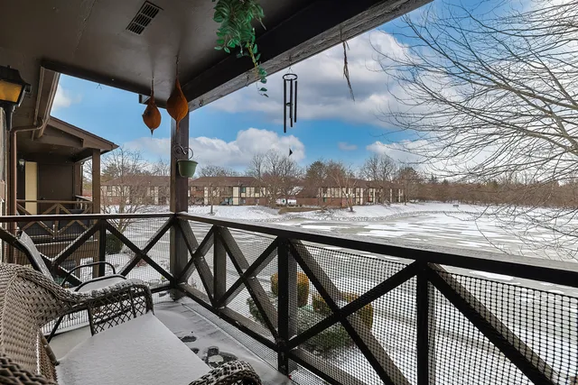 a view of a balcony with chairs