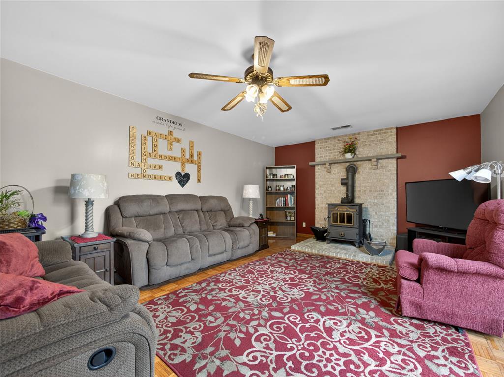 853 Lahr Road Nazareth, PA 18064 - Photo 7 of 29 Rich wood floors and a brick fireplace create a welcoming living space.