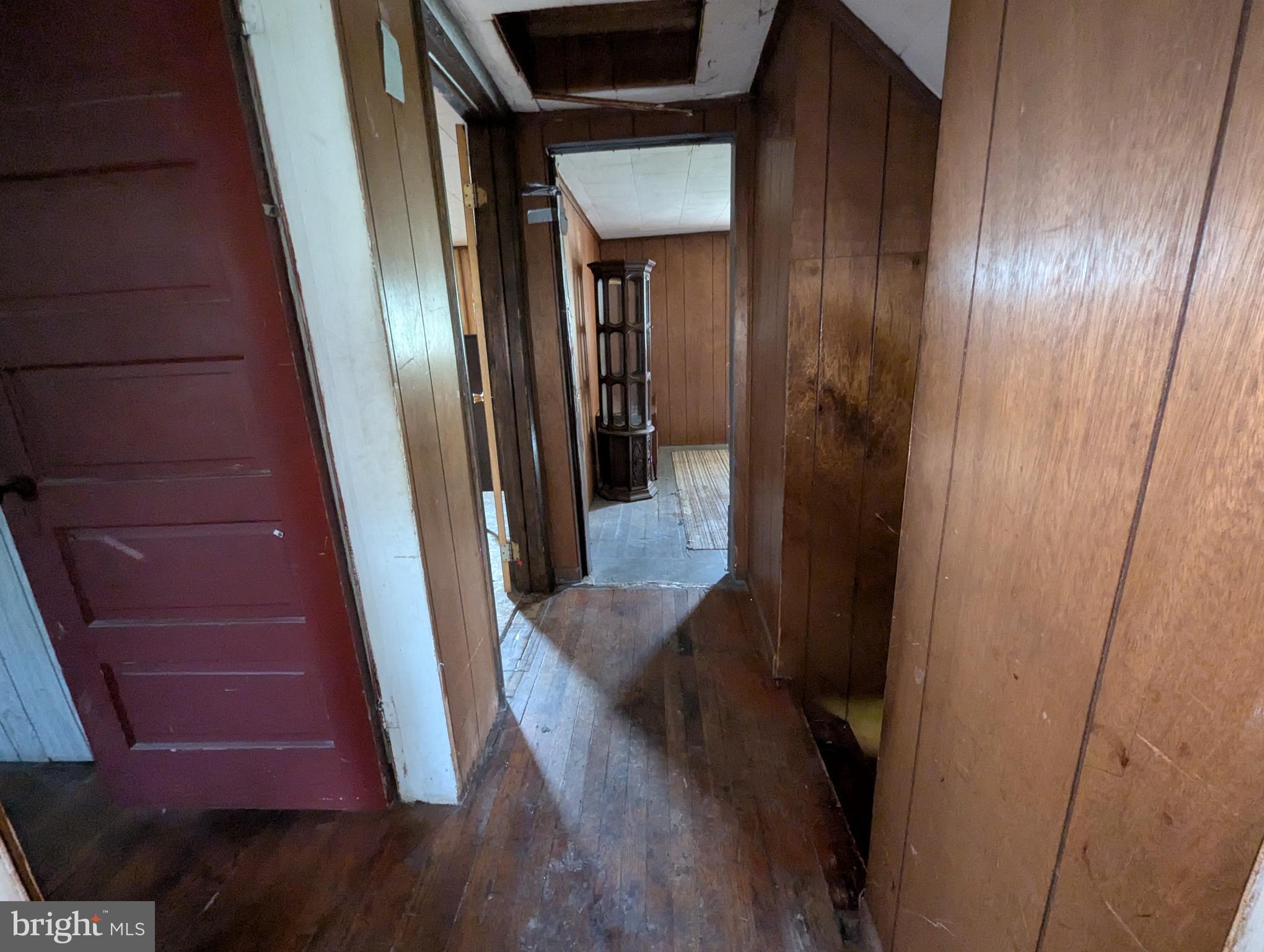 24001 Perry Hill Road Barton, MD 21521 - Photo 37 of 37 a view of a hallway with wooden floor and staircase