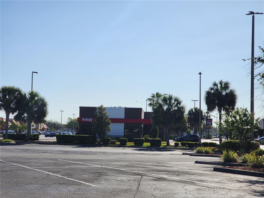 54 Sr New Port New Port Richey, FL 34653 - Photo 8 of 9 a building with view of a street
