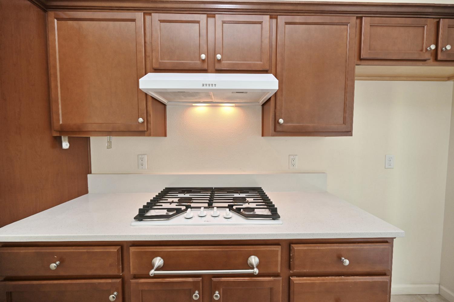 891 North Terra Cotta Drive Fresno, CA 93727 - Photo 11 of 32 a stove top oven sitting inside of a kitchen