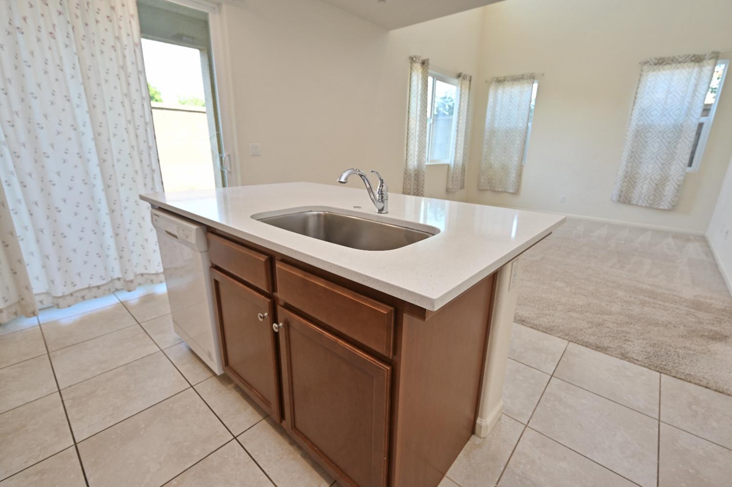 891 North Terra Cotta Drive Fresno, CA 93727 - Photo 10 of 32 a bathroom with a sink a vanity and a mirror