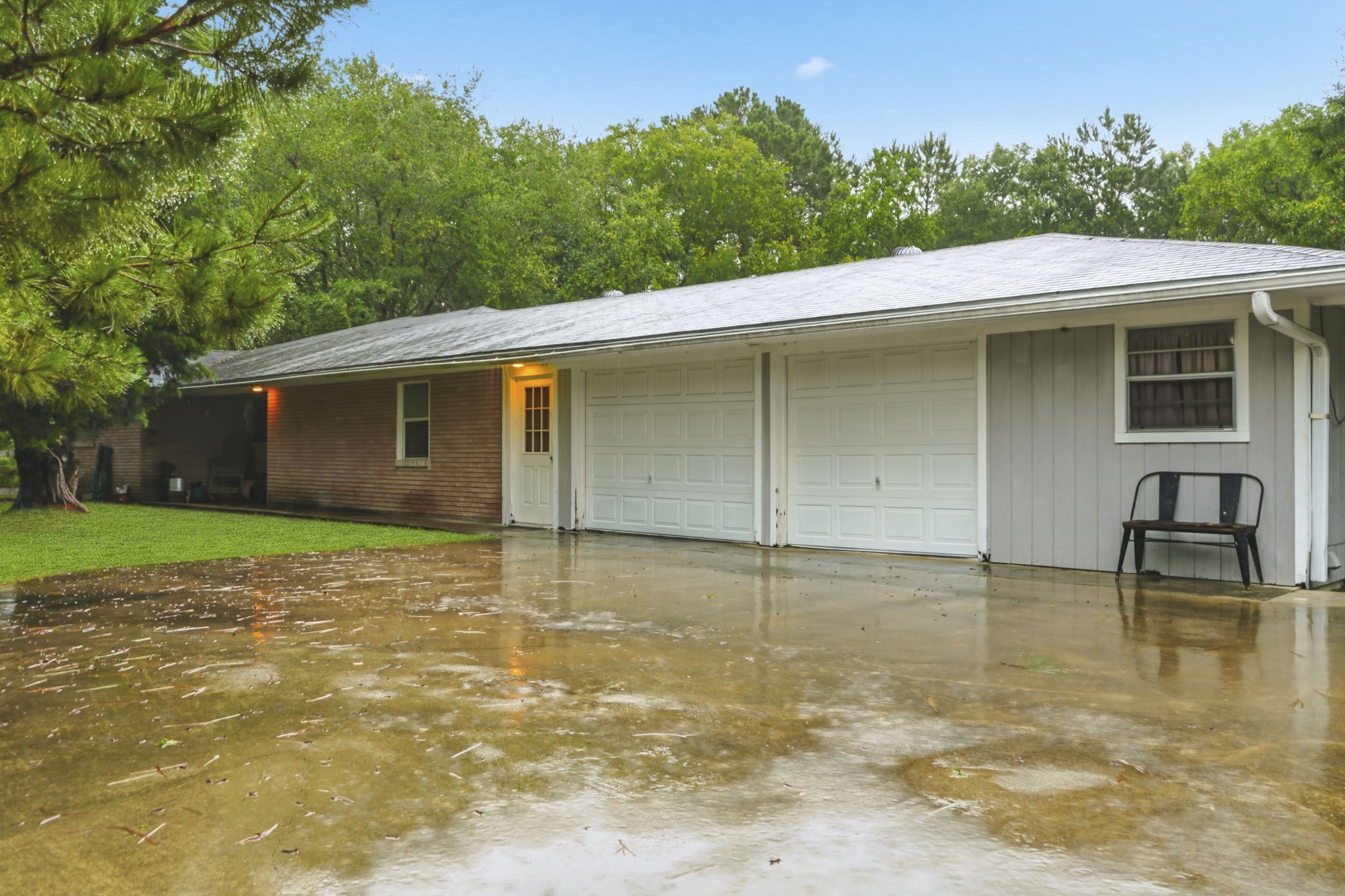 731 Meneley Road Winnie, TX 77665 - Photo 24 of 27 a backyard of a house with table and chairs