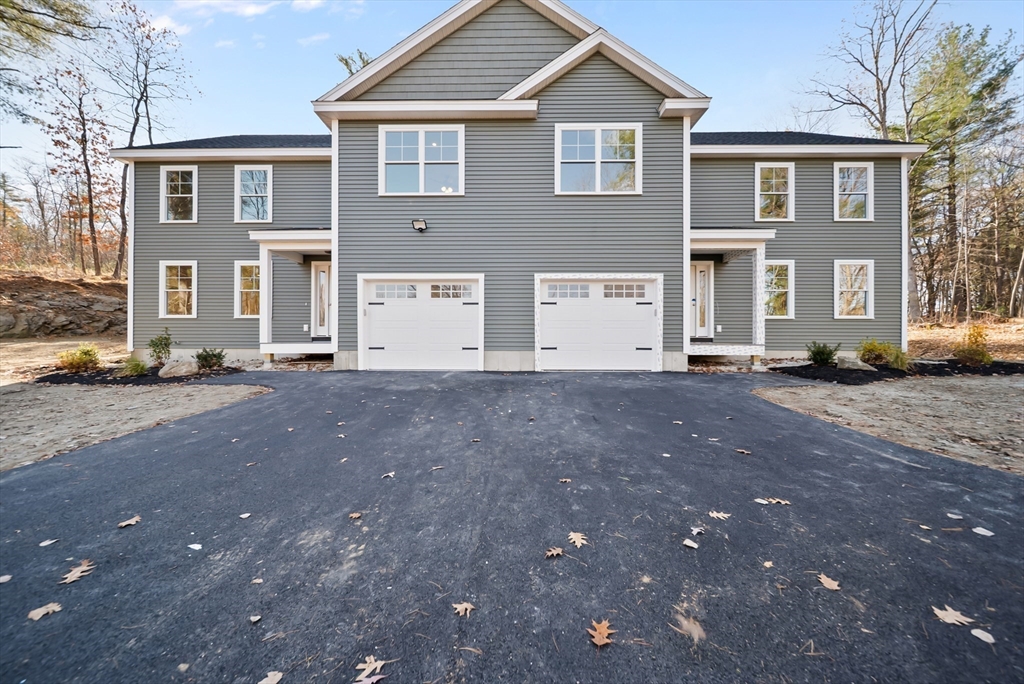 a view of an house with a street
