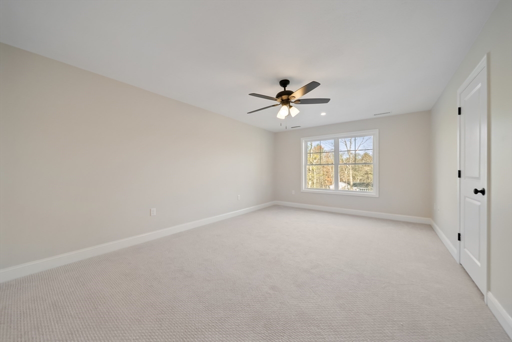 53 Kimball Hill Road, Unit A Hudson, NH 03051 - Photo 19 of 41 a view of an empty room with a window