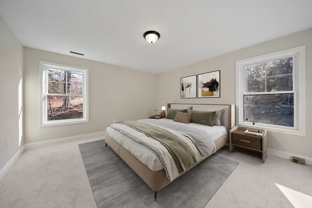 a bed room with a bed and a window