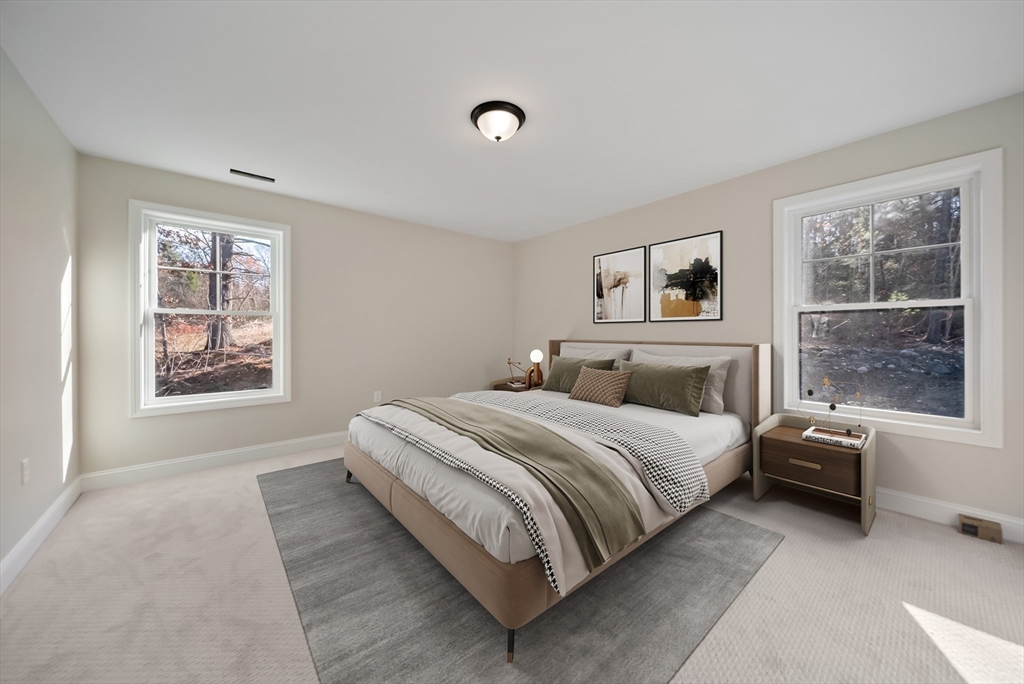 53 Kimball Hill Road, Unit A Hudson, NH 03051 - Photo 24 of 41 a bed room with a bed and a window