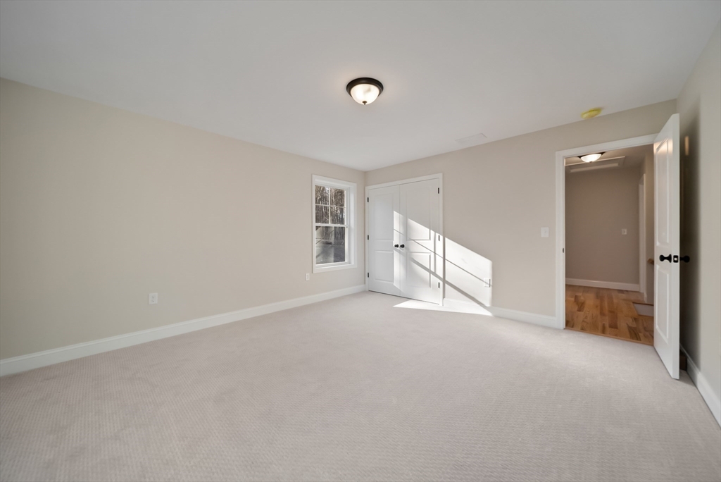 53 Kimball Hill Road, Unit A Hudson, NH 03051 - Photo 26 of 41 a view of an empty room with a window