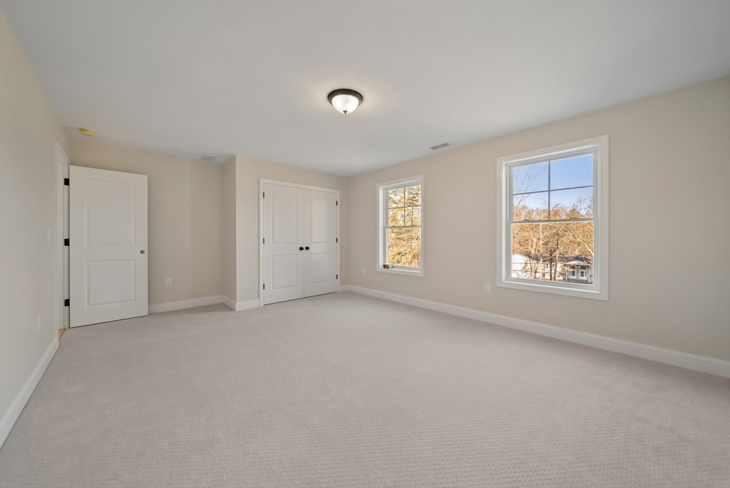 53 Kimball Hill Road, Unit A Hudson, NH 03051 - Photo 29 of 41 a view of an empty room with a window