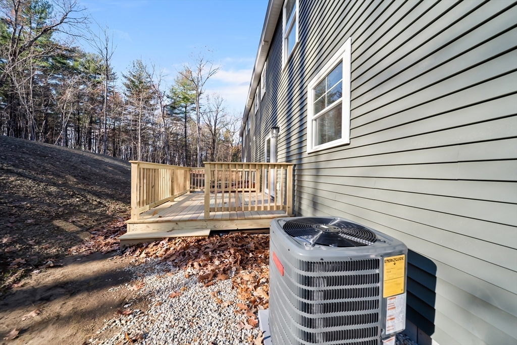 53 Kimball Hill Road, Unit A Hudson, NH 03051 - Photo 34 of 41 a view of a house with a yard