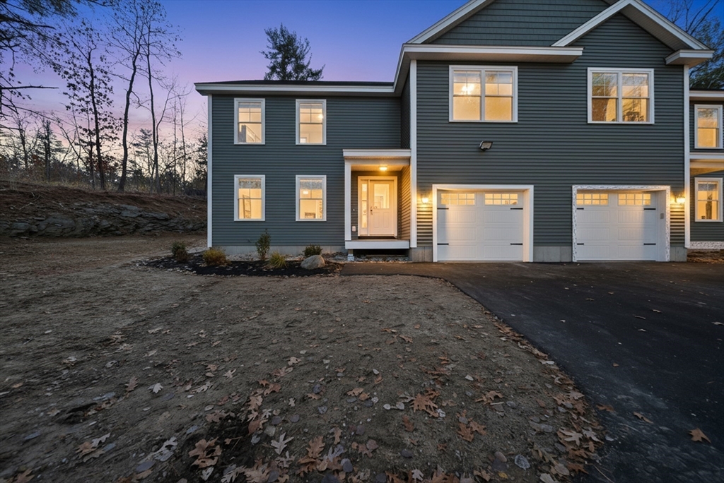 53 Kimball Hill Road, Unit A Hudson, NH 03051 - Photo 5 of 41 a front view of a house with a yard