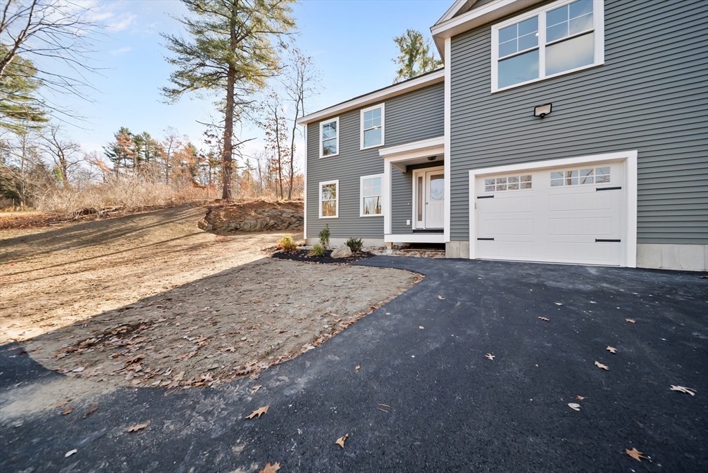 53 Kimball Hill Road, Unit A Hudson, NH 03051 - Photo 6 of 41 a view of a house with a snow on the road