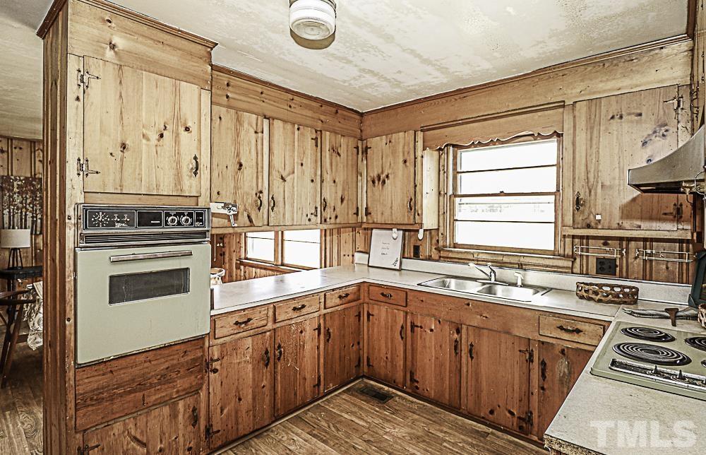 2508 Highway 42 Macclesfield, NC 27852 - Photo 14 of 24 a kitchen with stainless steel appliances a stove sink and cabinets