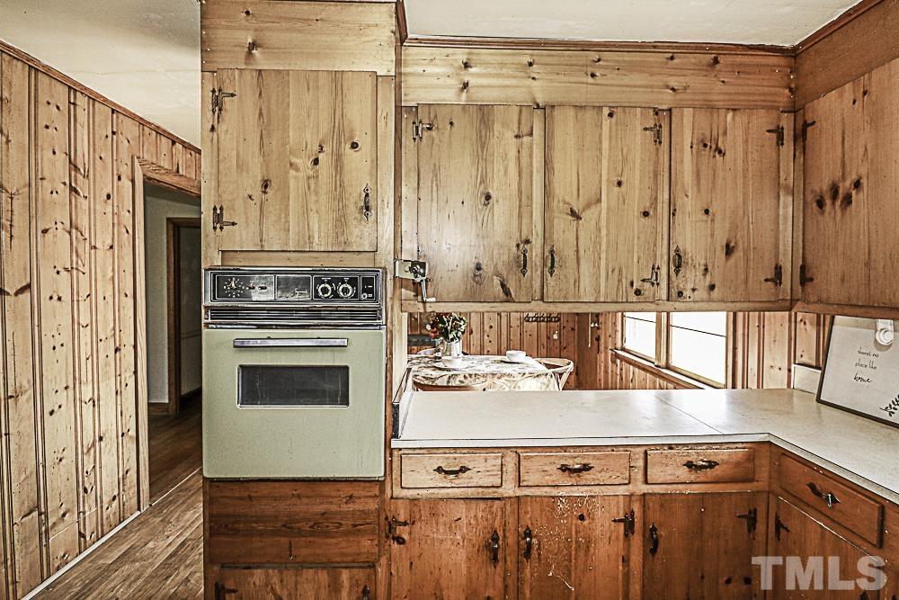 2508 Highway 42 Macclesfield, NC 27852 - Photo 15 of 24 a kitchen with a refrigerator and a stove