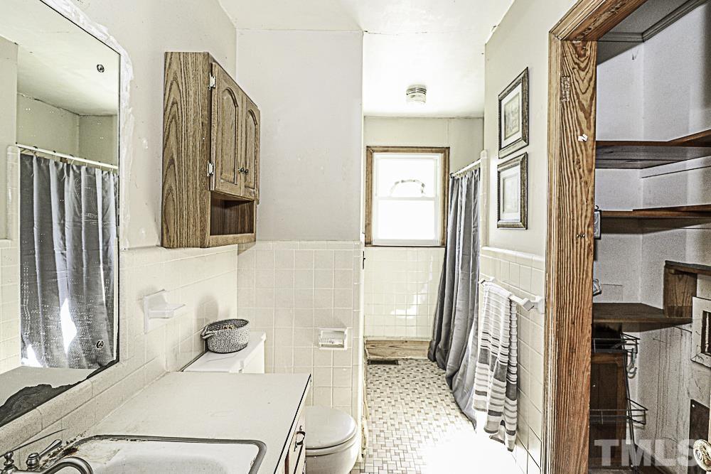 2508 Highway 42 Macclesfield, NC 27852 - Photo 18 of 24 a bathroom with a sink toilet and shower