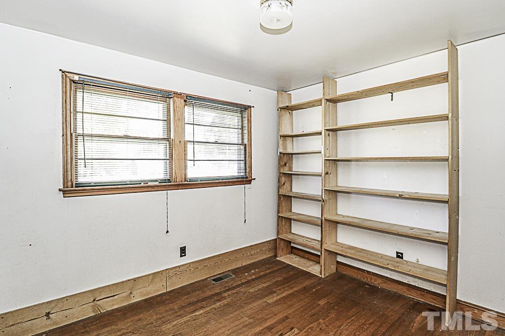 2508 Highway 42 Macclesfield, NC 27852 - Photo 21 of 24 a view of an empty room with a window and wooden floor