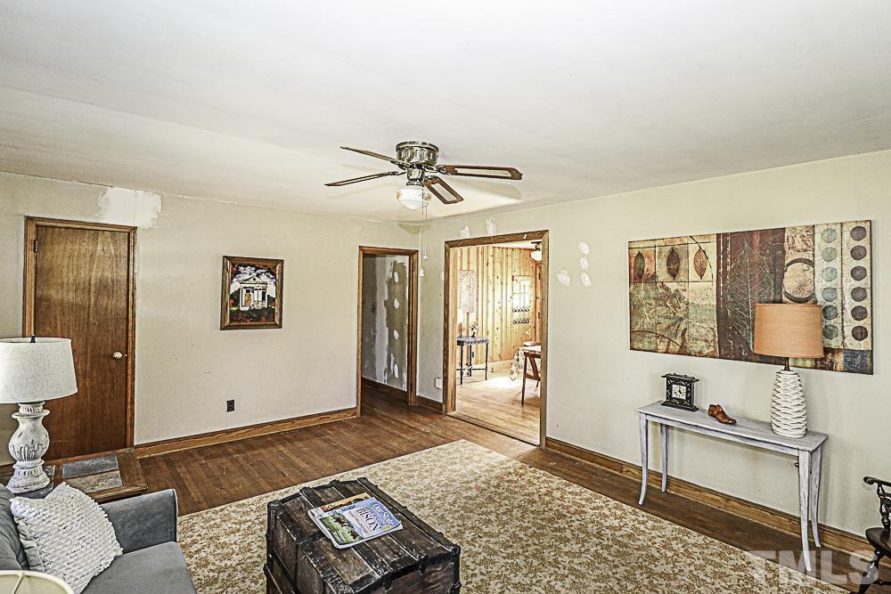2508 Highway 42 Macclesfield, NC 27852 - Photo 8 of 24 a living room with furniture and a rug