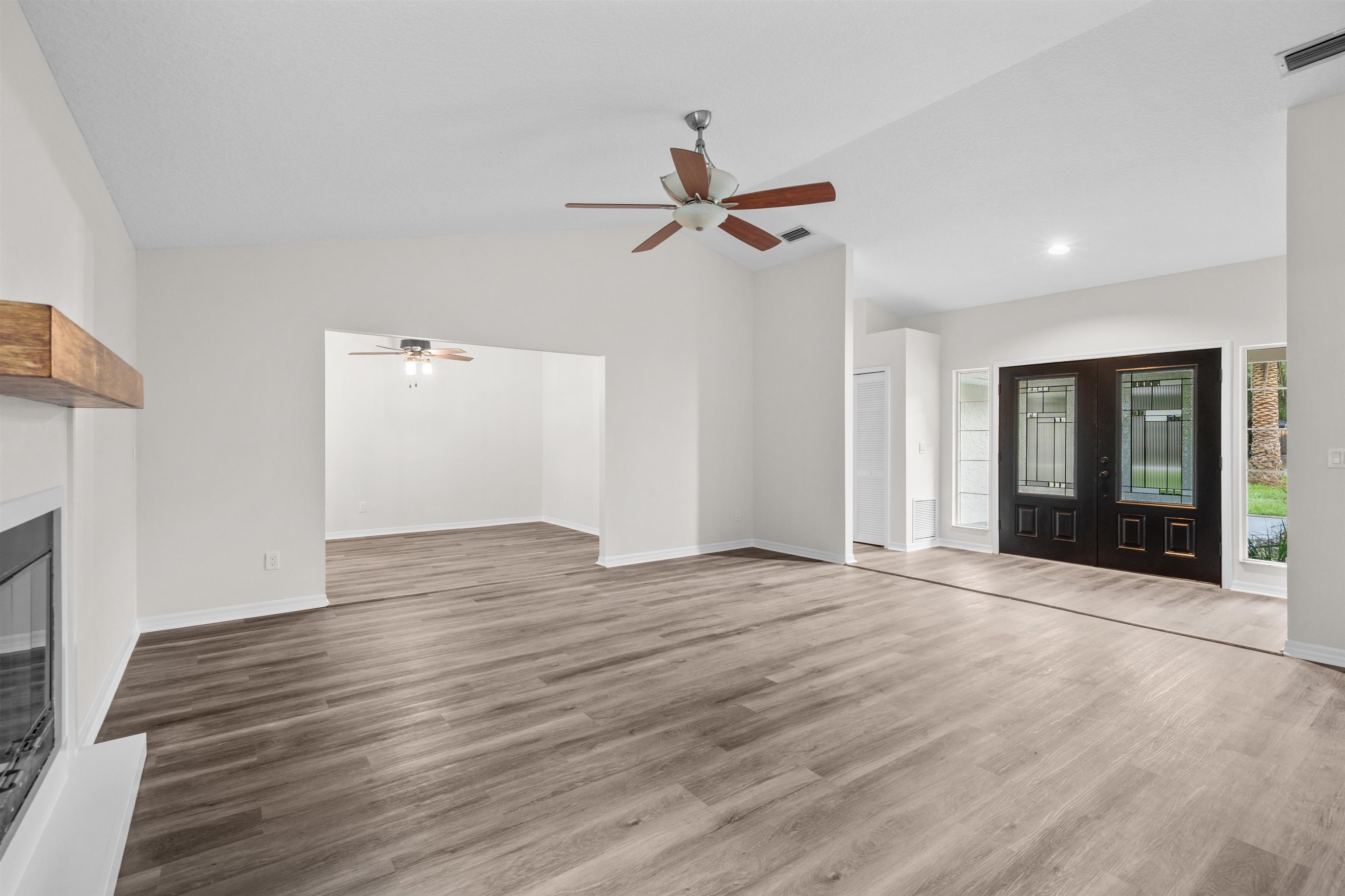 3508 Kings Road South St. Augustine, FL 32086 - Photo 12 of 32 wooden floor in an empty room with a window
