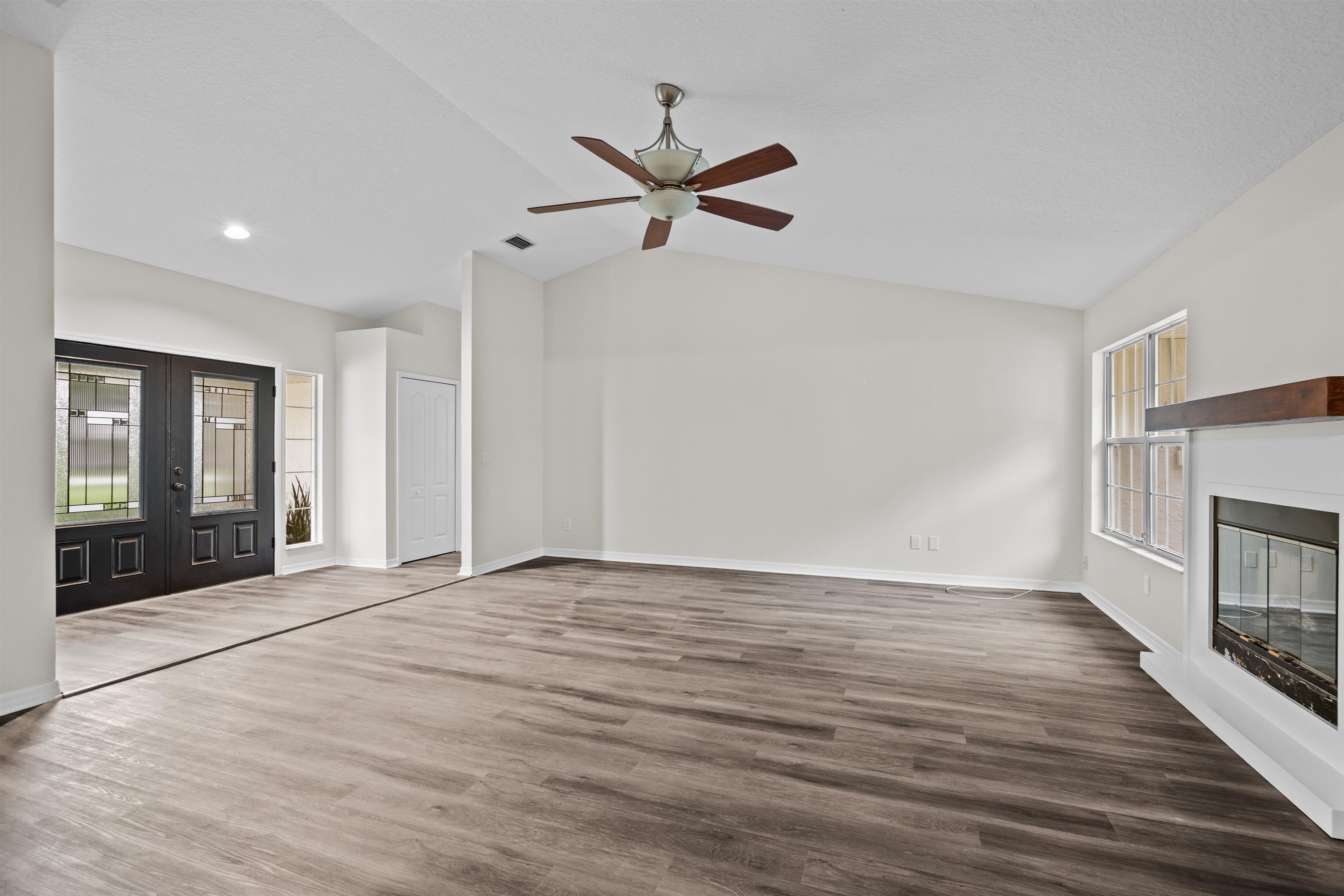3508 Kings Road South St. Augustine, FL 32086 - Photo 13 of 32 a view of empty room with wooden floor and fan