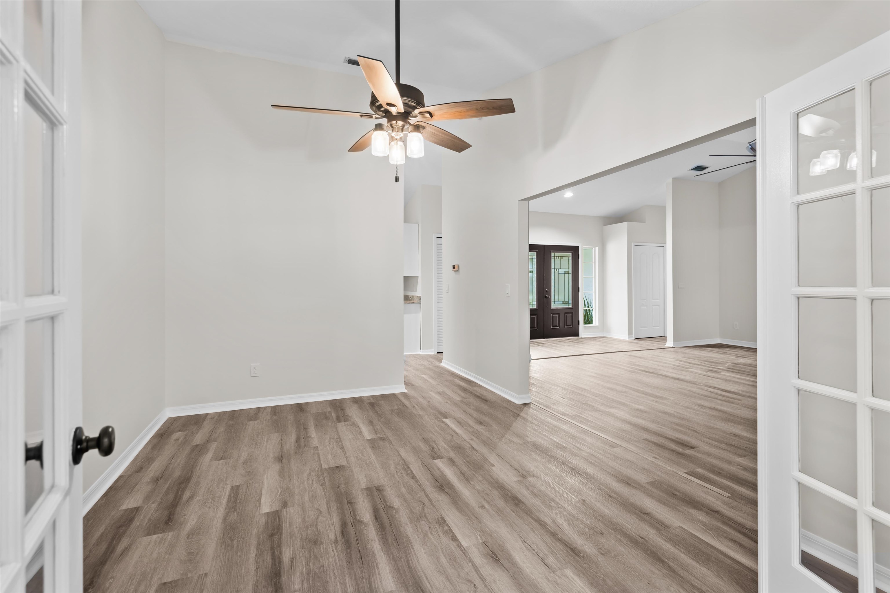 3508 Kings Road South St. Augustine, FL 32086 - Photo 15 of 32 wooden floor in an empty room with a window