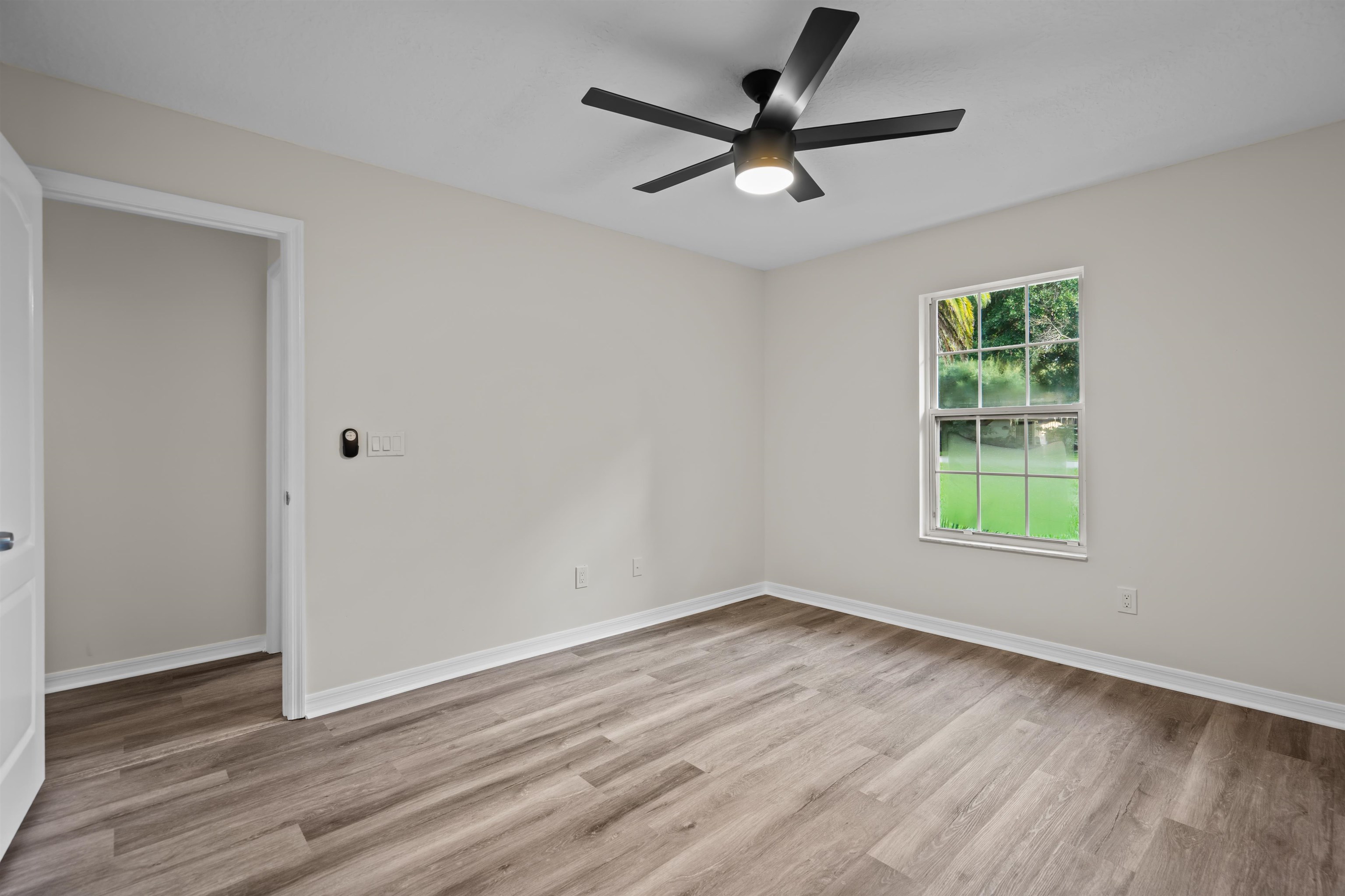 3508 Kings Road South St. Augustine, FL 32086 - Photo 22 of 32 a view of a big room with wooden floor and windows