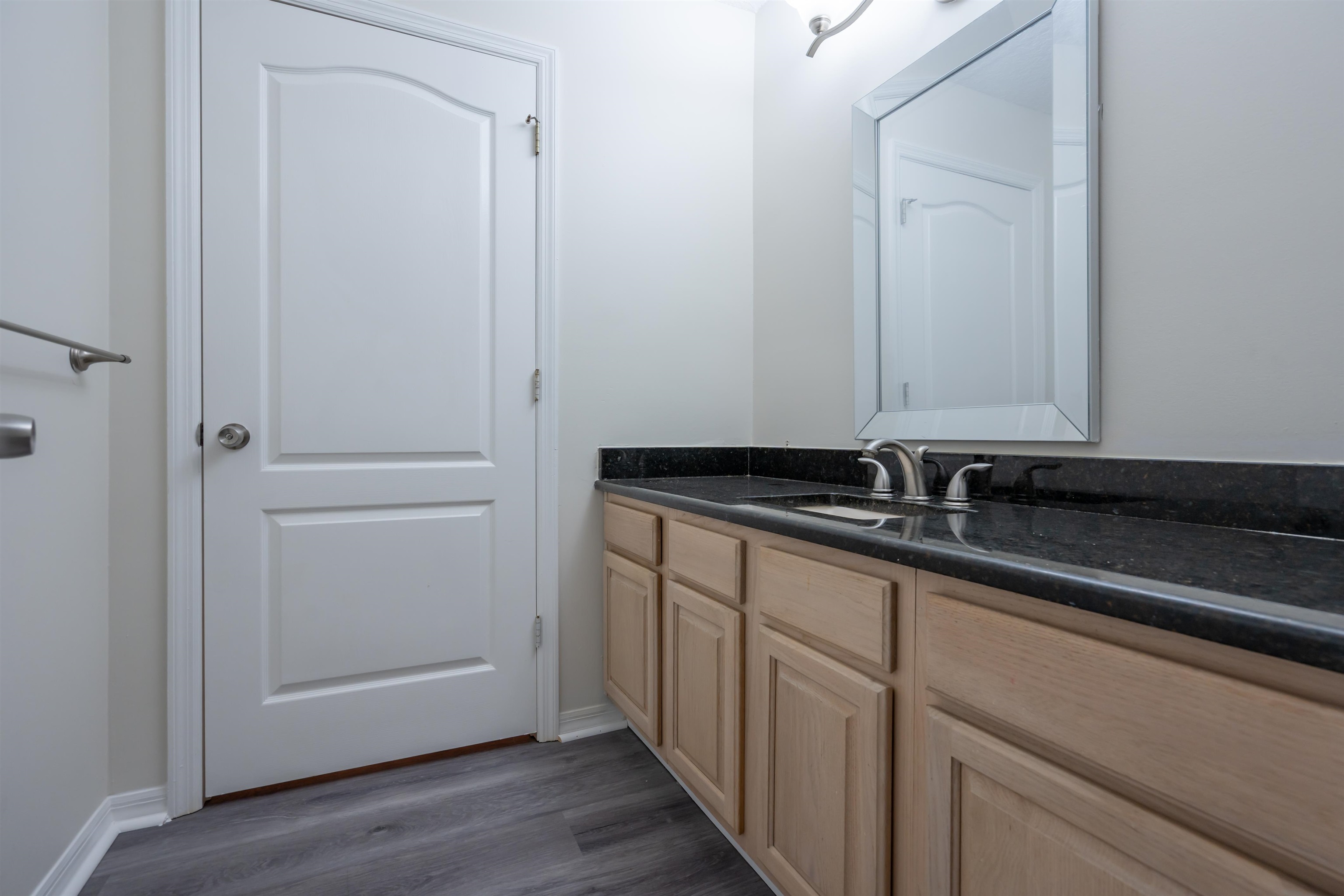 3508 Kings Road South St. Augustine, FL 32086 - Photo 26 of 32 a bathroom with a sink and a mirror