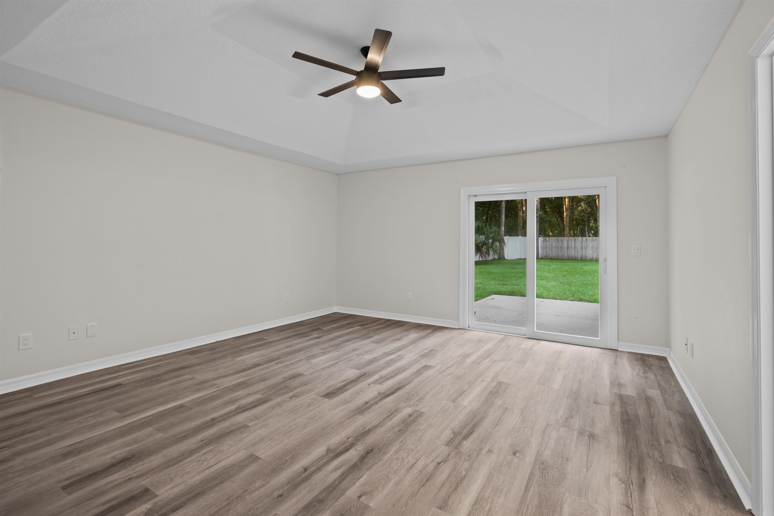 3508 Kings Road South St. Augustine, FL 32086 - Photo 28 of 32 wooden floor in an empty room with a window