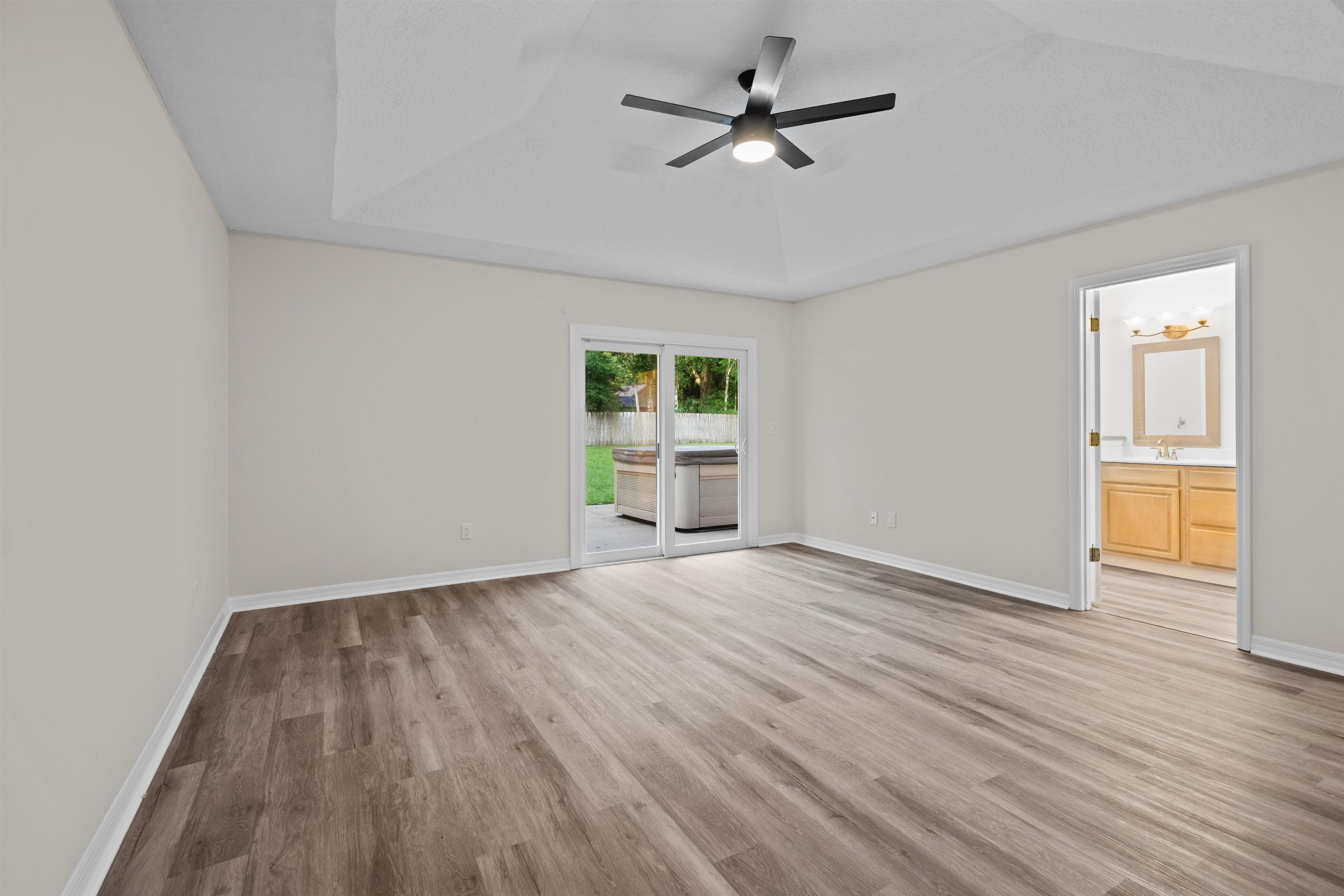 3508 Kings Road South St. Augustine, FL 32086 - Photo 29 of 32 a view of an empty room with wooden floor and a window