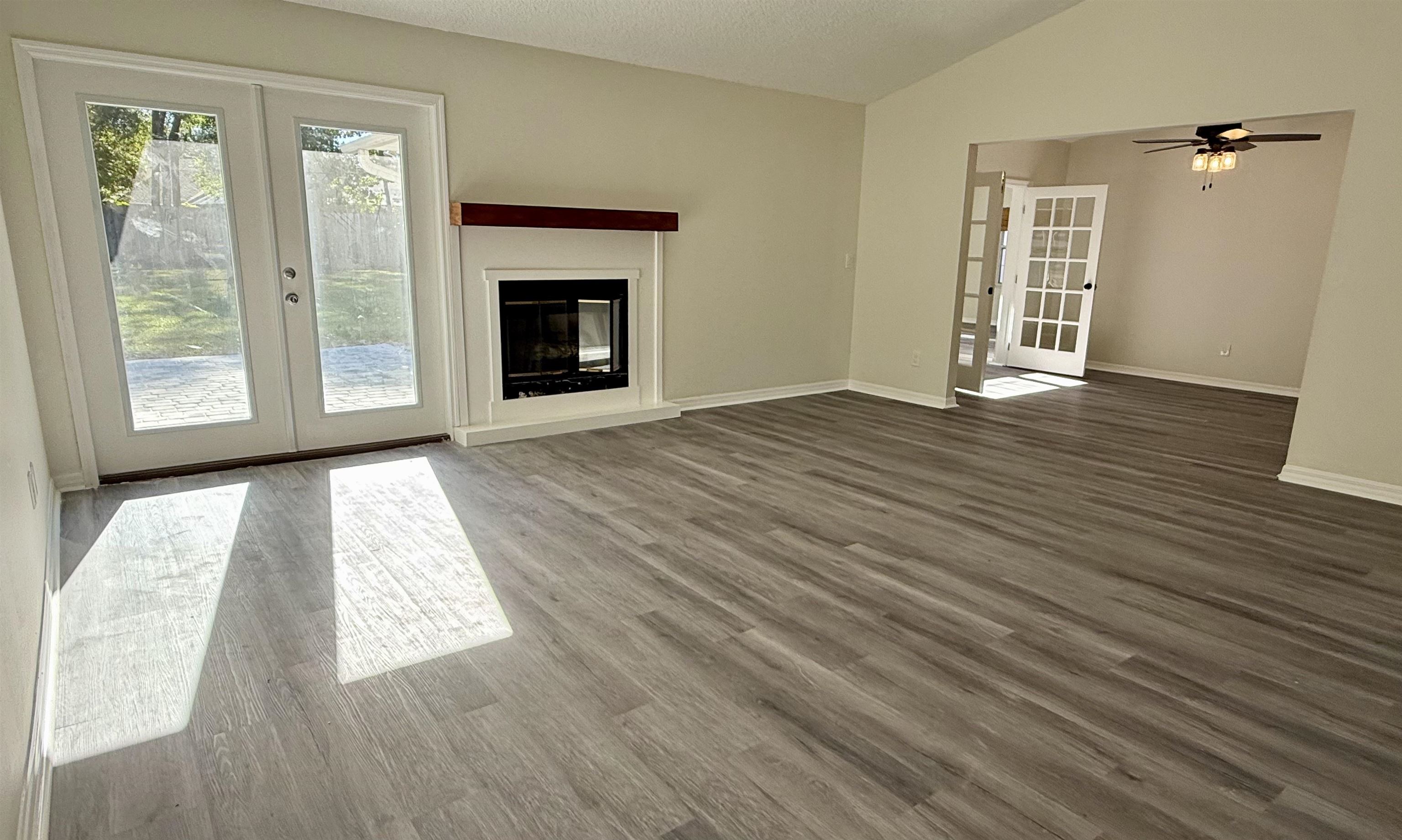 3508 Kings Road South St. Augustine, FL 32086 - Photo 9 of 32 a view of an empty room with wooden floor and a window