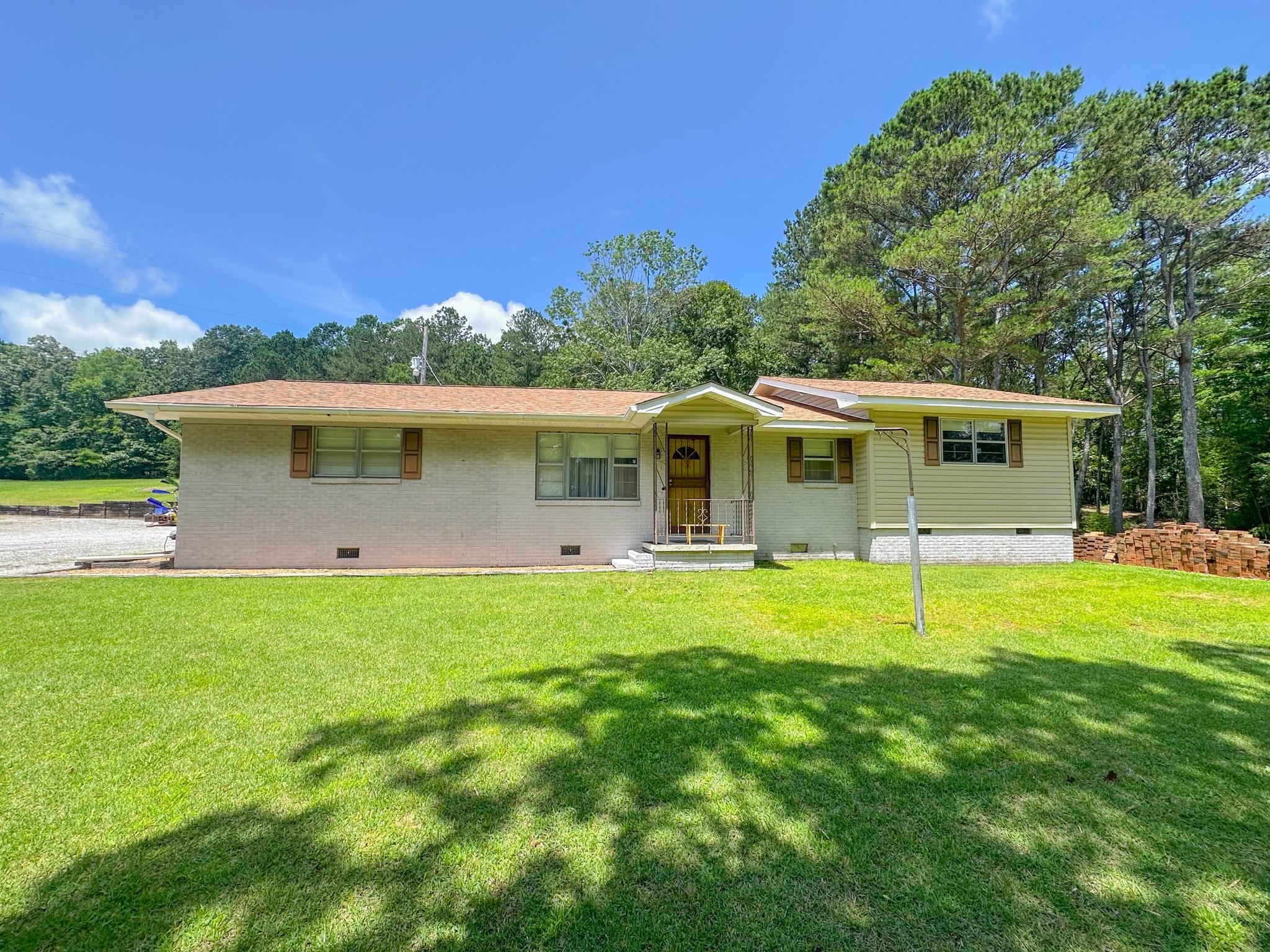 1630 Pleasant Hill Road Iuka, MS 38852 - Photo 1 of 14 a backyard of a house with table and chairs
