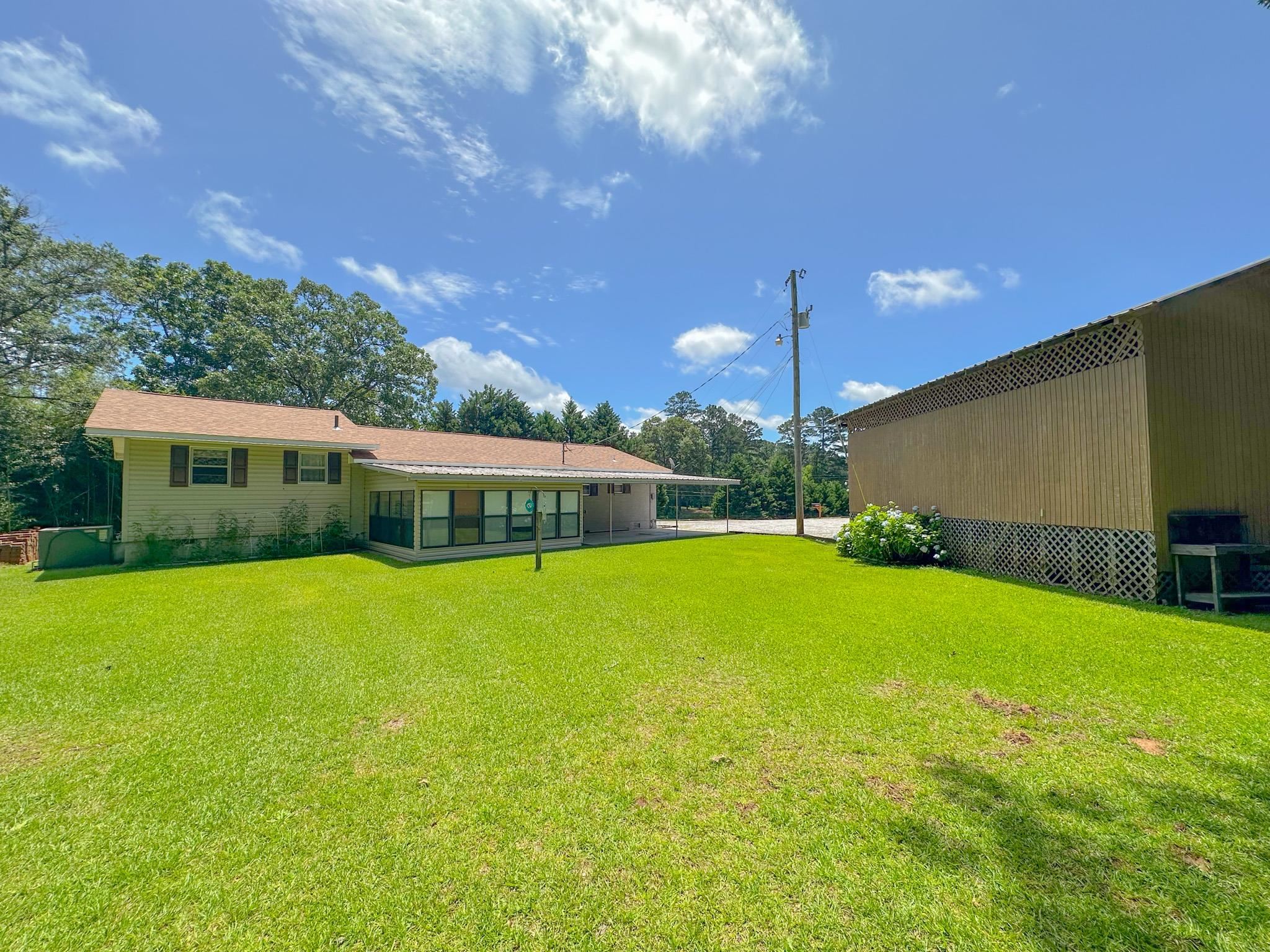 1630 Pleasant Hill Road Iuka, MS 38852 - Photo 14 of 14 a front view of a house with a garden
