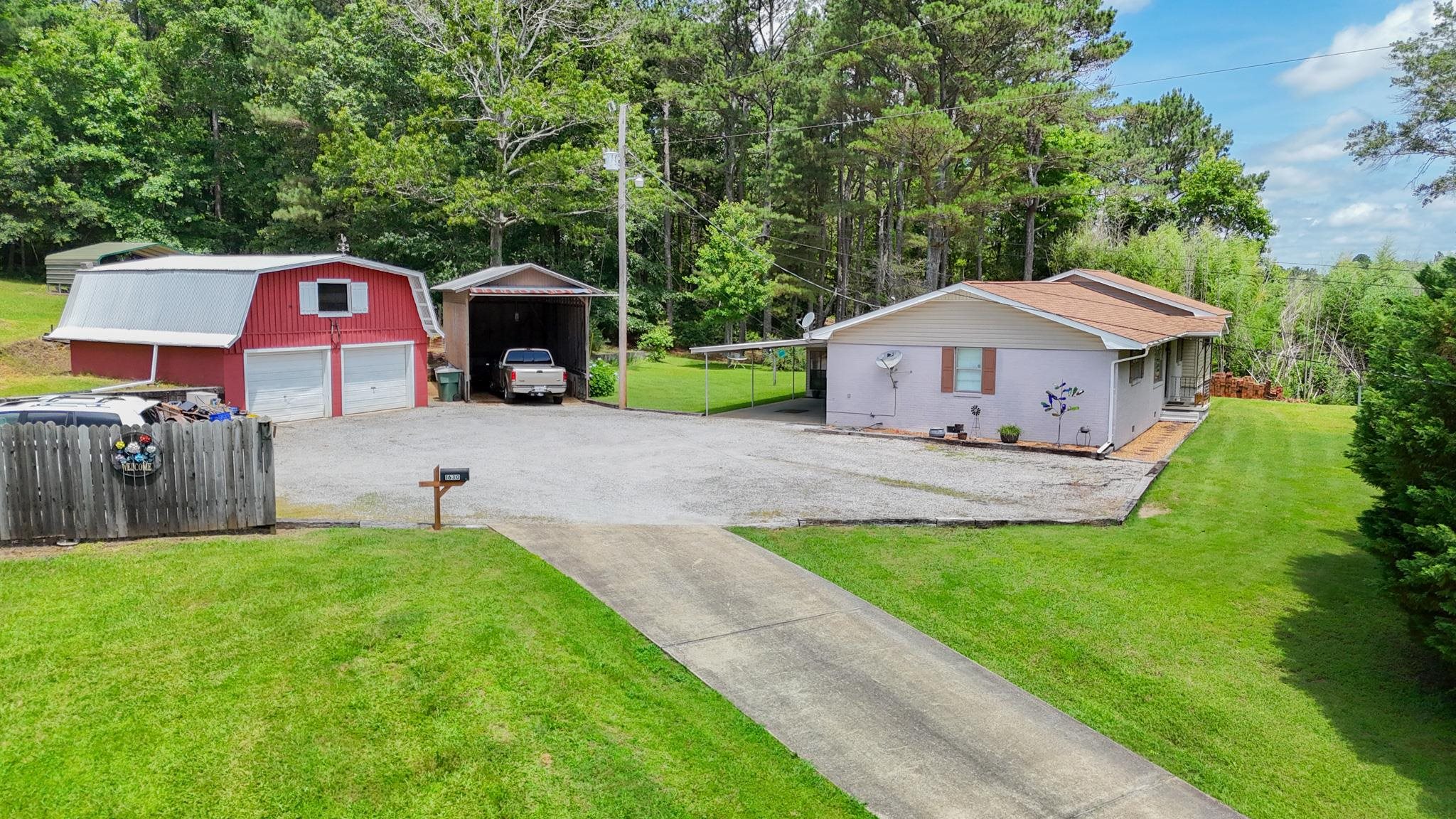 1630 Pleasant Hill Road Iuka, MS 38852 - Photo 2 of 14 a front view of a house with garden