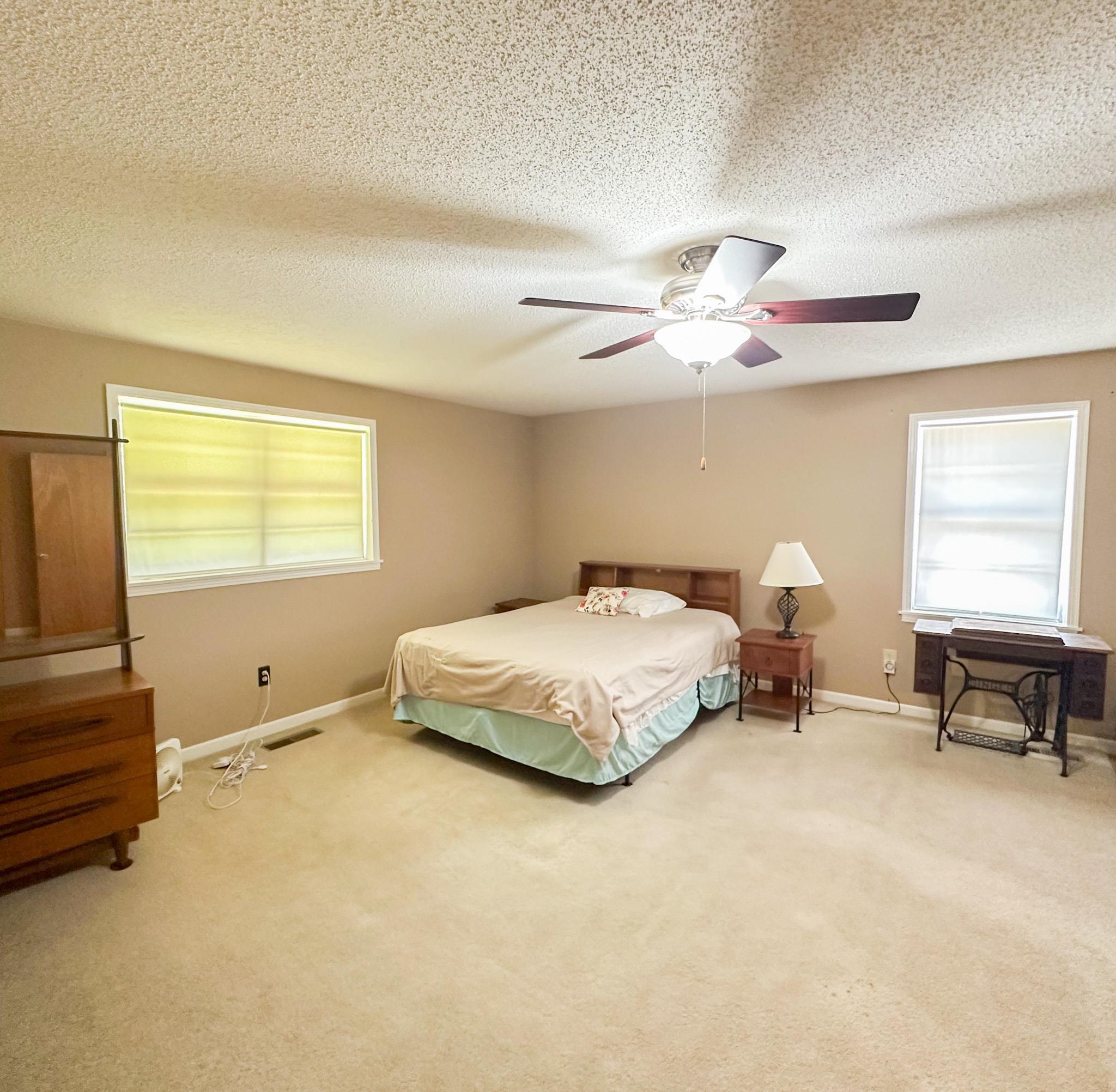 1630 Pleasant Hill Road Iuka, MS 38852 - Photo 8 of 14 a bedroom with a bed and furniture