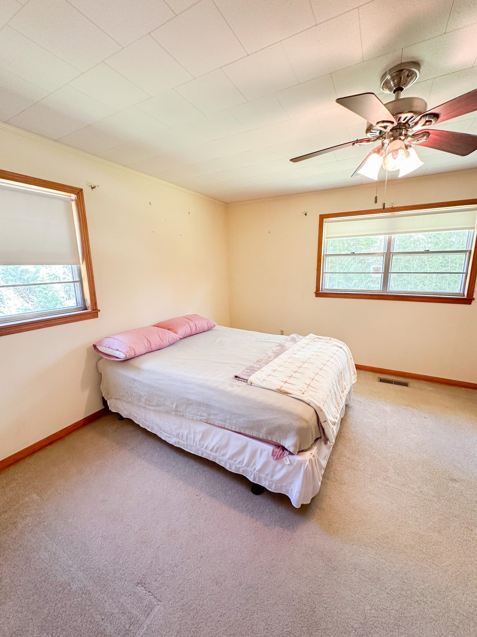1630 Pleasant Hill Road Iuka, MS 38852 - Photo 10 of 14 a bedroom with a bed and window