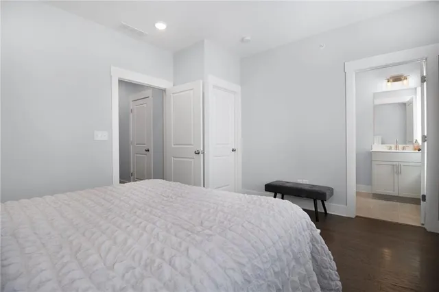 a bedroom with a bed and a table in it