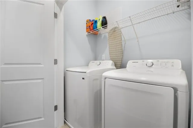 a utility room with dryer and washer