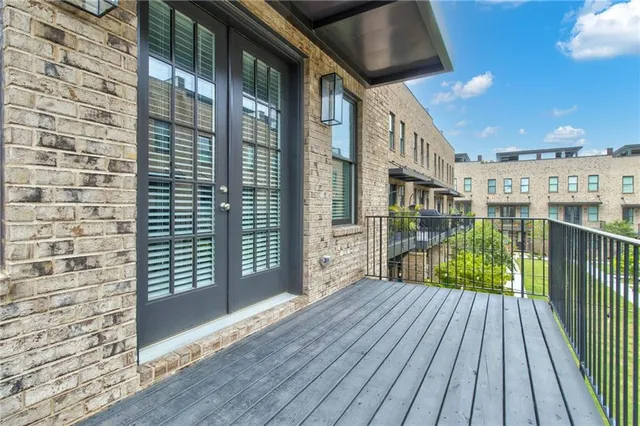 a view of balcony with wooden floor